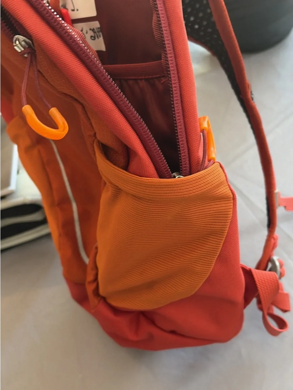 OSPREY Kids Daylite Jr Daypack in Bright Orange with Blue Hydration Reservoir
